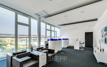 Contemporary office space rental at Badenerstrasse 549, Zürich Old Town, featuring comfortable seating, stylish interior, and ample natural light.